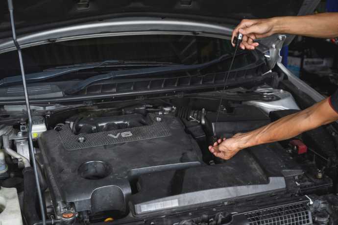 By Adding Automatic Transmission Fluid