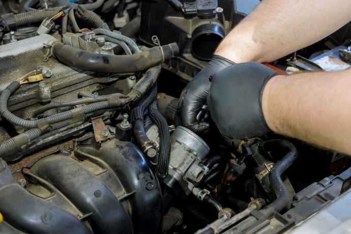 By Repairing the Throttle Position Sensor